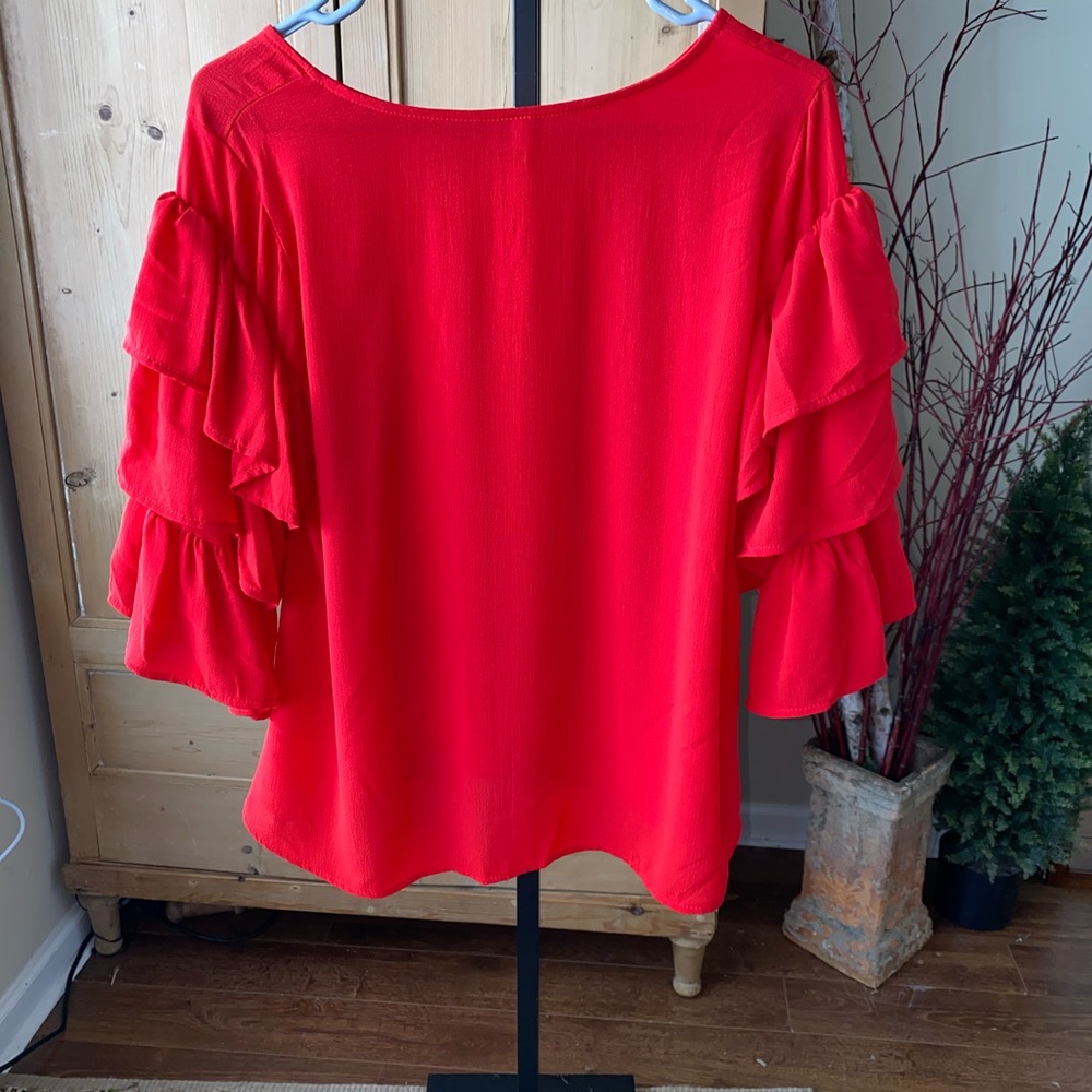 Women’s red ruffled sleeve shirt